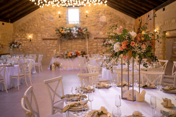 Autumn wedding table setting with flower centerpieces and candles. Wedding day. Autumn wedding decorations. - Photo, Image