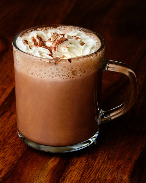 Hot chocolate drink with whipped cream in glass cup - Foto, Bild