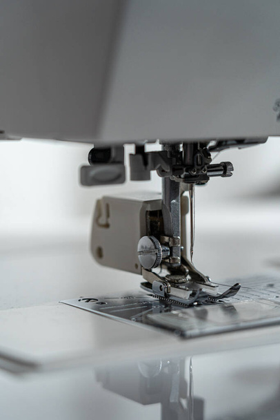 Needle of a sewing machine and part around it - Foto, Bild