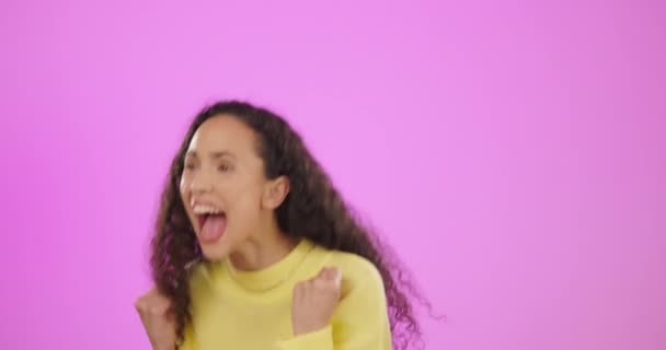 Screaming winner, woman and fist in studio for celebration, achievement deal and success. Happy female model, yes and celebrate on pink background in lottery, winning shock or smile of crazy surprise. - Footage, Video