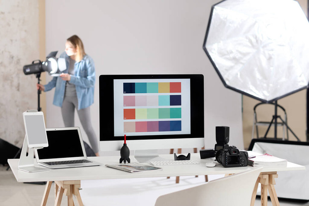 Photographer's workplace with devices in studio - Photo, Image