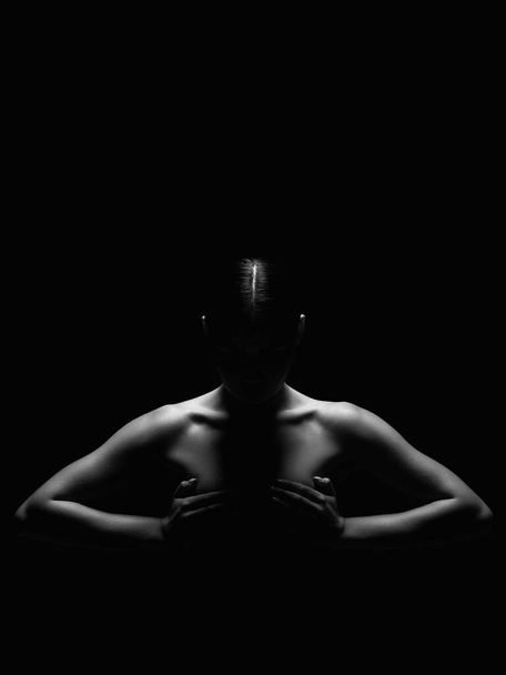 Nude Woman silhouette in the dark. Beautiful Naked Body Girl. Black and white portrait - Photo, Image