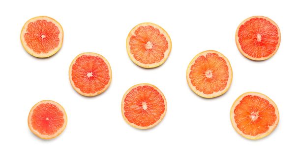 Composition with slices of ripe grapefruit on white background - Fotografie, Obrázek