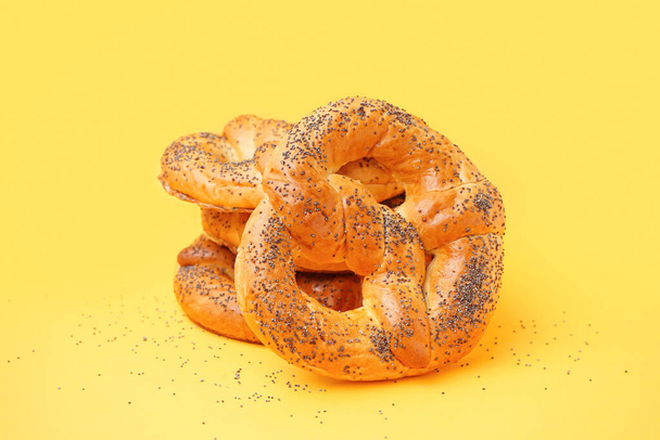 Stack of tasty pretzels on yellow background - Fotografie, Obrázek