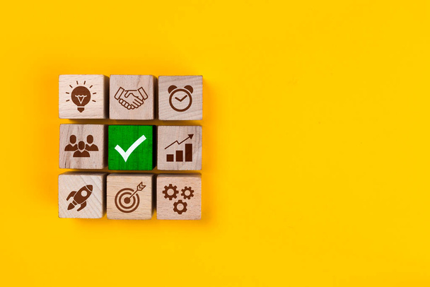Business process management. Wooden blocks with icon business strategy on yellow backgroun - Photo, Image