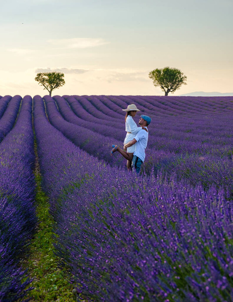 Provence, Lavender field France, Valensole Plateau, a colorful field of Lavender Valensole Plateau, Provence, Southern France Couple men and women on vacation - Φωτογραφία, εικόνα