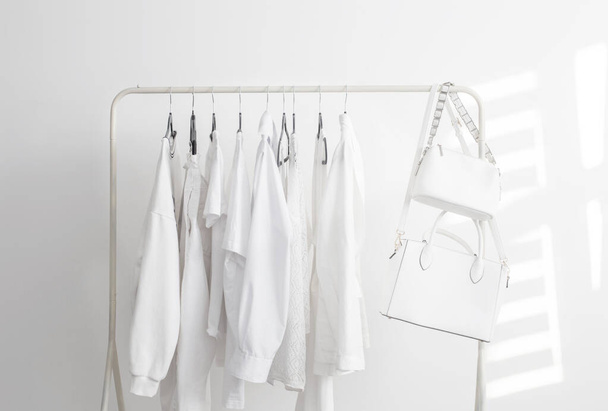 female white capsule summer wardrobe in  white room - Foto, immagini