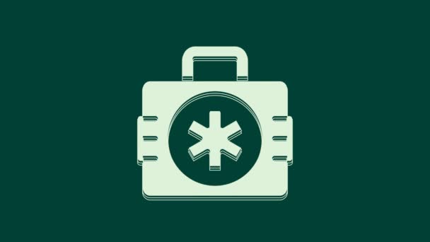 Biały zestaw pierwszej pomocy ikona izolowana na zielonym tle. Skrzynka medyczna z krzyżem. Sprzęt medyczny na wszelki wypadek. Koncepcja opieki zdrowotnej. 4K Animacja graficzna ruchu wideo. - Materiał filmowy, wideo