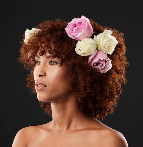 Thinking, beauty and flowers with a model black woman in studio on a dark background for natural skincare. Wellness, luxury and idea with an attractive young female wearing a flower crown or wreath. - Photo, Image