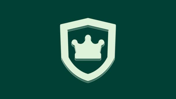 White Shield with crown icon isolated on green background. 4K Video motion graphic animation. - Footage, Video