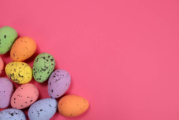 decorative easter eggs on pink background - Фото, изображение