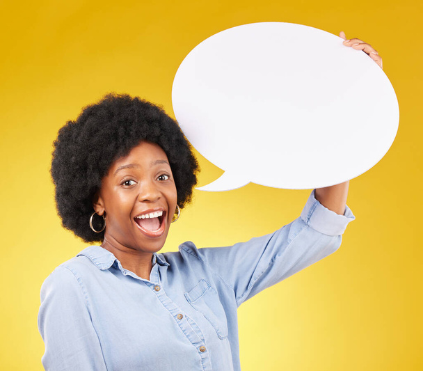Speech bubble, portrait and happy black woman in studio with mockup for social media, advertising or space. Face, poster and girl with billboard on news, announcement or branding on yellow background. - Foto, immagini