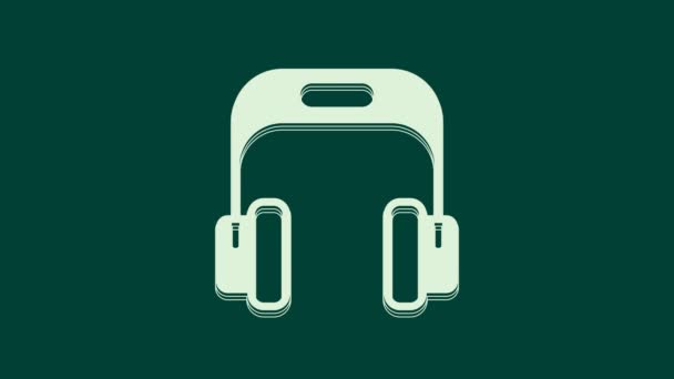 White Headphones icon isolated on green background. Earphones. Concept for listening to music, service, communication and operator. 4K Video motion graphic animation. - Footage, Video