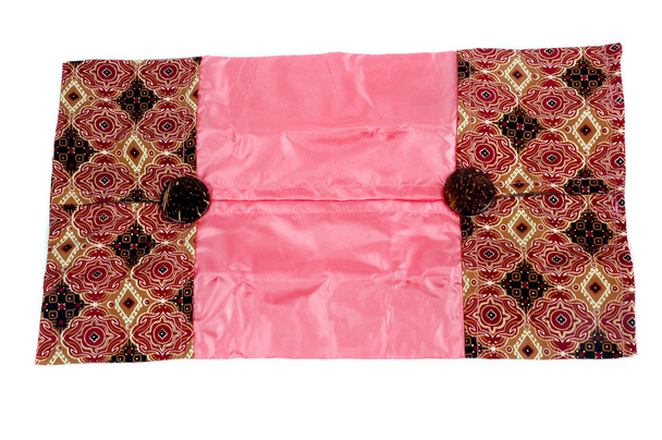 Una guantera de pañuelos de tela batik estampada
 - Foto, Imagen
