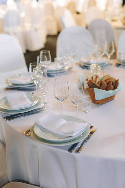elegant table setting in restaurant for wedding party. High quality photo - Φωτογραφία, εικόνα