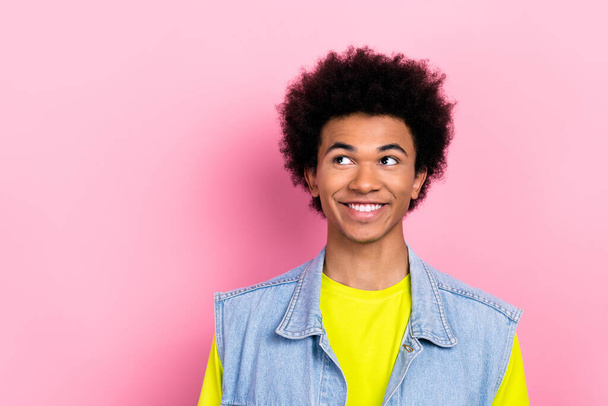 Photo of cheerful funky man beaming smile look interested empty space isolated on pink color background. - Foto, immagini