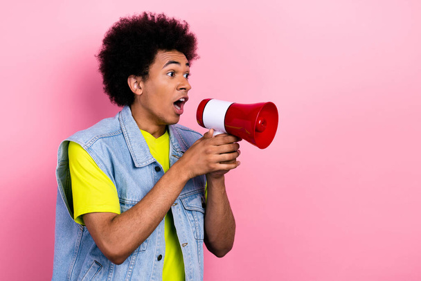 Photo of crazy young person arms hold loudspeaker say tell empty space isolated on pink color background. - Фото, изображение