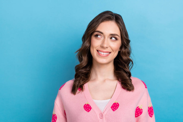Closeup portrait photo of dreamy cute lady wavy hair smiling wear pink stylish cardigan look empty space gift idea isolated on blue color background. - Foto, immagini