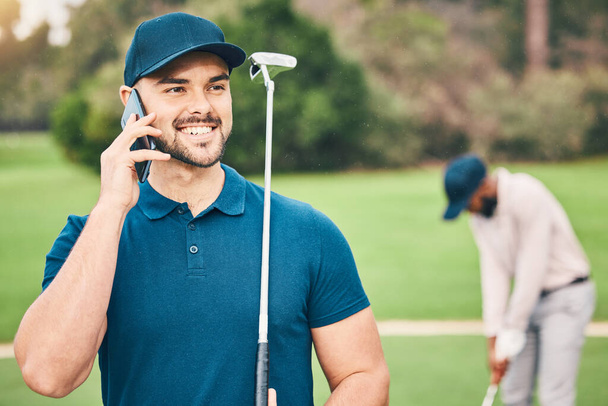 Man, phone call and communication on golf course for sports conversation or discussion in the outdoors. Happy sporty male smiling and talking on smartphone while golfing in sport hobby in nature. - Photo, image