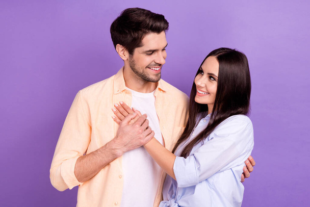Photo portrait of positive love story concept boyfriend hugs his girlfriend idyllic relationship valentine day isolated on violet color background. - Photo, Image