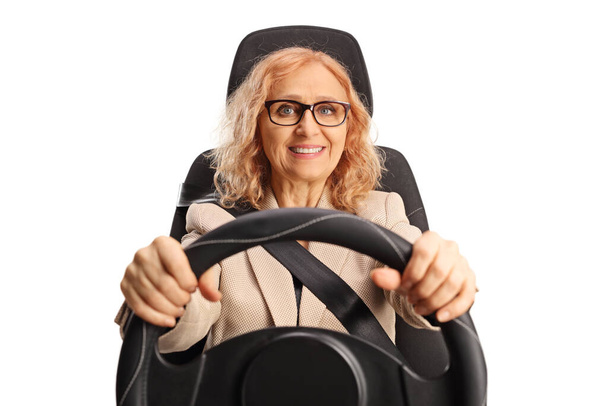 Portrait of a woman with glasses driving a car isolated on white background - Foto, imagen