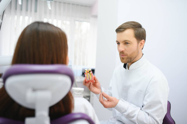 Beautiful young woman having dental treatment at dentist's office - Zdjęcie, obraz