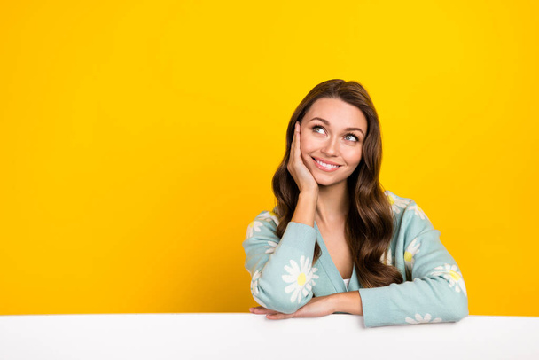 Portrait of lovely positive person hand touch cheek look empty space ad isolated on yellow color background. - Foto, Bild