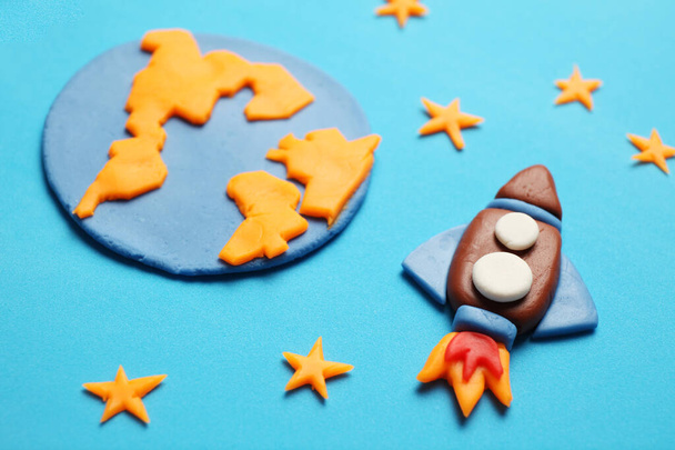 Kid (child) rocket in space, adventure and science. Stars, and moon. Plasticine art, cartoon. - Photo, image