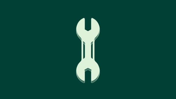 Значок гаечного ключа белого цвета выделен на зеленом фоне. Инструмент для ремонта ключей. Символ служебного инструмента. Видеографическая анимация 4K. - Кадры, видео