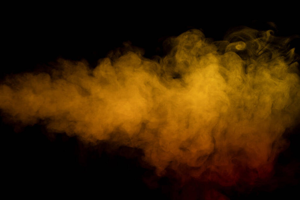 Orange and red steam on a black background. Copy space. - Foto, Imagen