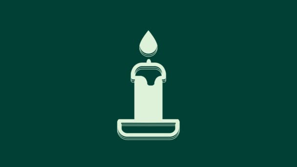 White Burning candle in candlestick icon isolated on green background. Cylindrical candle stick with burning flame. 4K Video motion graphic animation. - Footage, Video