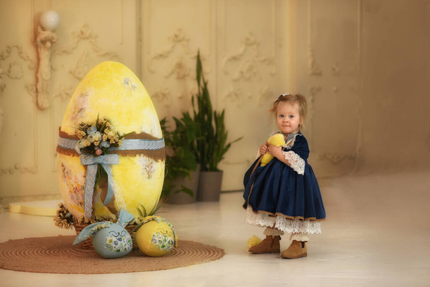 Little beautiful girl and Easter decor. Easter eggs. - Photo, image