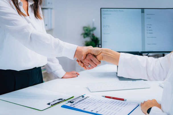 Handshake After Signing Health Insurance Form - Фото, изображение