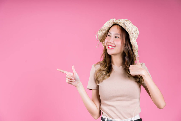 Excited success achievement and glad celebrating of Happy asian young woman confident smiling on the pink background - Φωτογραφία, εικόνα