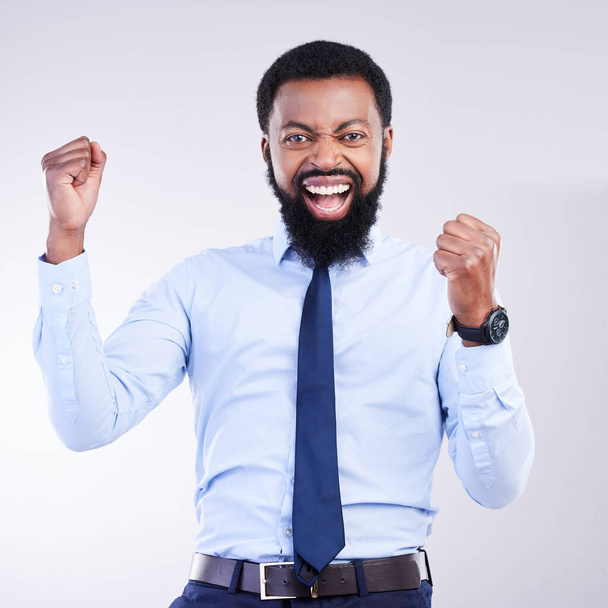 Success, fist and black man portrait isolated on gray background in celebration for career opportunity, bonus or winning. Winner or business person celebrate corporate promotion or job news in studio. - Foto, Imagen