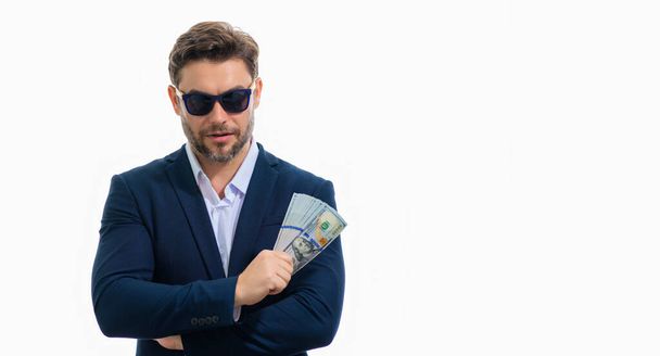 Man in suit with money cash. Dollar banknotes. Portrait of man holding american money banknotes. Dollar bills, credit, online banking. Rich man point at dollar banknotes, bank loan, financial savings - Zdjęcie, obraz