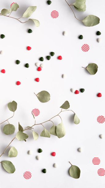 Eucalyptus Twigs in a Flat Lay on off White Paper with an Envelope, Candy and Sweets - Fotó, kép
