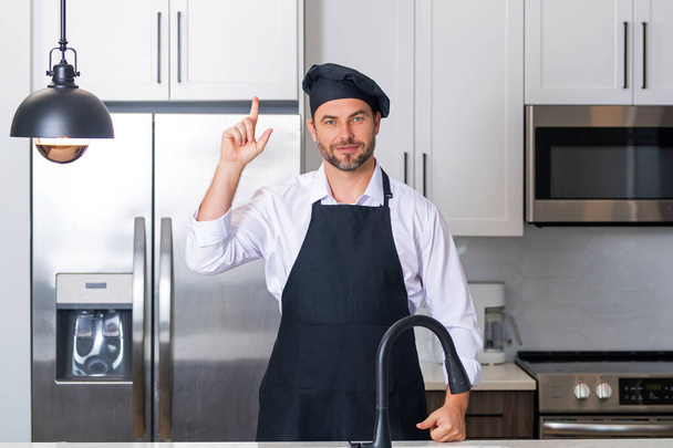 Cooking and culinary concept. Chef cook in uniform on kitchen. Male chef or cook baker man in apron cooking. Portrait of chef cook in beret. Cooking food concept - Фото, зображення