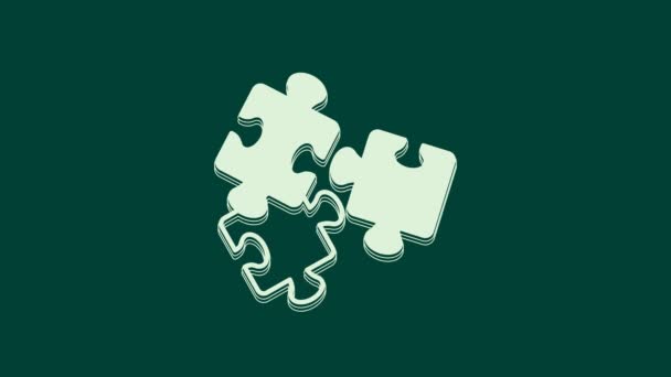 Weiße Puzzleteile Spielzeugikone isoliert auf grünem Hintergrund. 4K Video Motion Grafik Animation. - Filmmaterial, Video