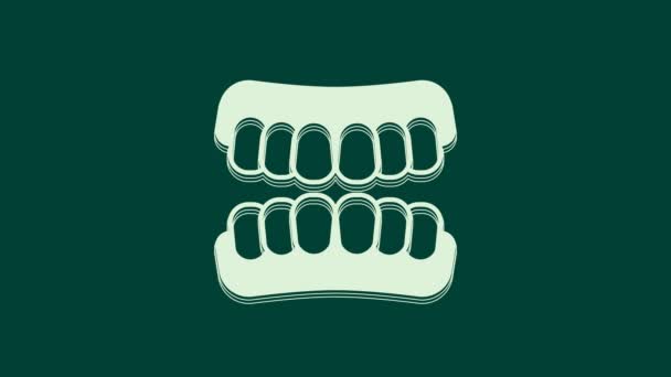 White Dentures model icon isolated on green background. Teeth of the upper jaw. Dental concept. 4K Video motion graphic animation. - Footage, Video