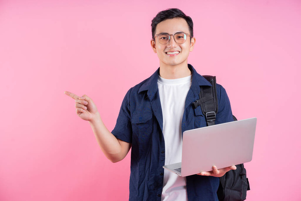 Image of young Asian college student on pink background - Φωτογραφία, εικόνα