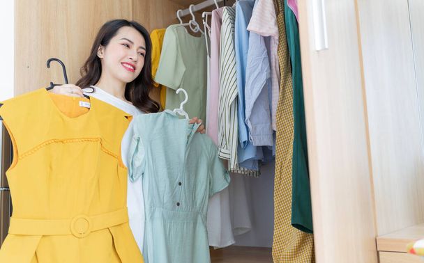 Young Asian woman trying on clothes - Photo, Image
