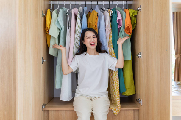 Young Asian woman with full wardrobe - Photo, Image