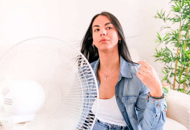 Woman suffering summer heat trying to stay cool and comfortable during heat wave - Photo, Image