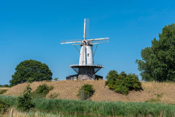 Windmill De Koe at the former bastion in Veere. Veere is a city in the province of Zeeland in the Netherlands - Photo, Image