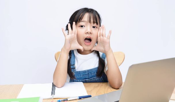 Photo of Asian kid studying on background - Photo, Image