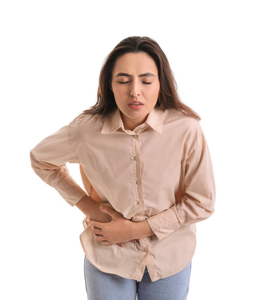 Young woman with appendicitis on white background - Foto, afbeelding