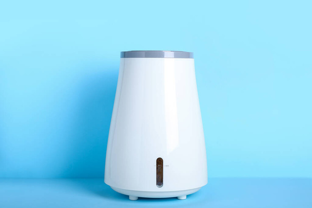 Modern humidifier on blue background - Photo, Image