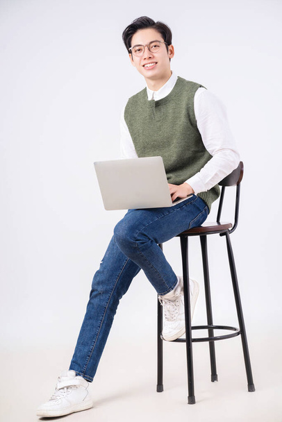Image of young Asian man on white background - Foto, Imagem