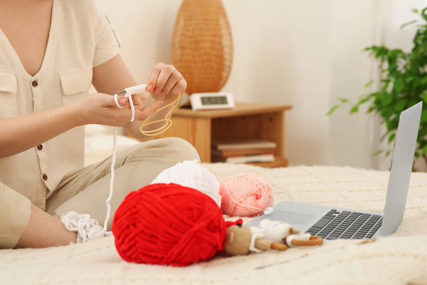 Closeup view of woman learning to knit with online course at home, space for text. Handicraft hobby - Foto, immagini